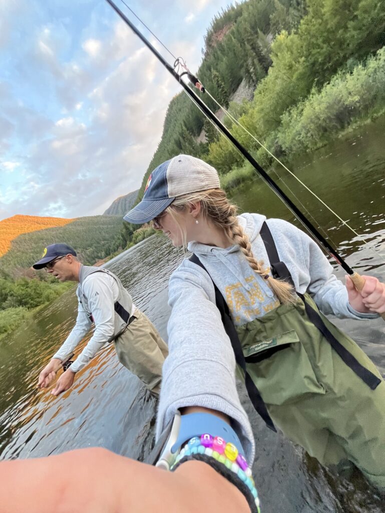 Ashley and her dad fishing.