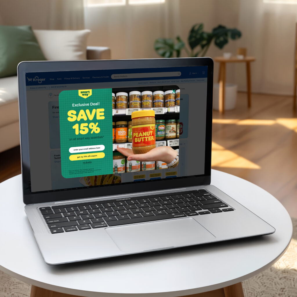 Laptop displaying a Smart Way promotional pop-up ad on a clean desk in a modern kitchen.